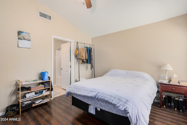 bedroom featuring dark wood-type flooring, vaulted ceiling, and ceiling fan