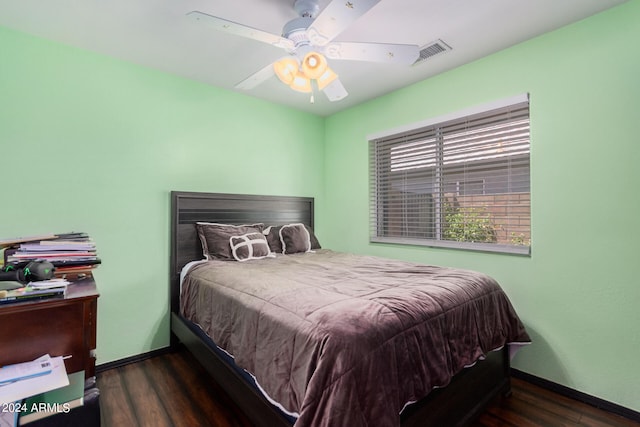 bedroom with ceiling fan and dark hardwood / wood-style floors