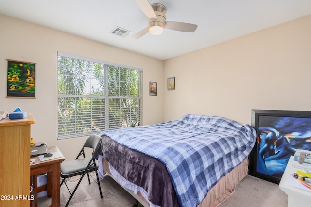 carpeted bedroom with ceiling fan