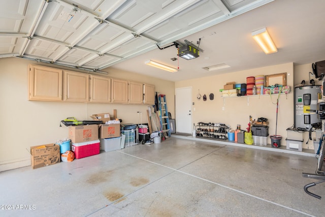 garage featuring a garage door opener and electric water heater