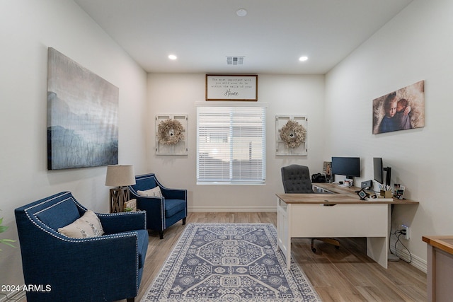 office area featuring light wood-style floors, recessed lighting, visible vents, and baseboards