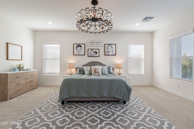 bedroom with recessed lighting, visible vents, light carpet, and baseboards