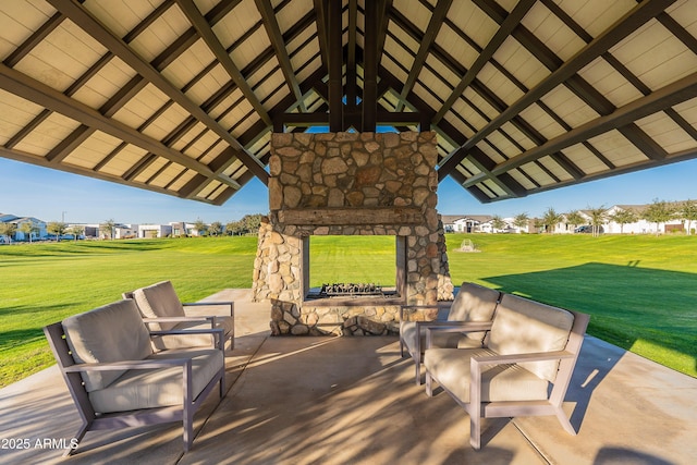 view of patio with an outdoor stone fireplace