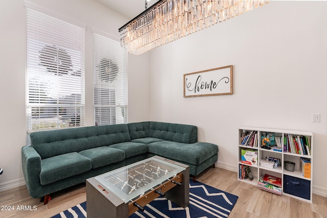 living area featuring baseboards and wood finished floors