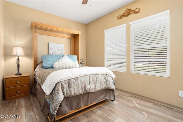 bedroom with wood-type flooring and ceiling fan