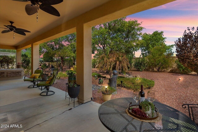 patio terrace at dusk with ceiling fan