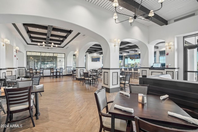 dining room featuring light parquet flooring, a chandelier, and beam ceiling