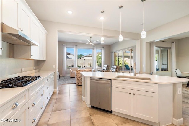 kitchen with white cabinetry, sink, pendant lighting, and appliances with stainless steel finishes