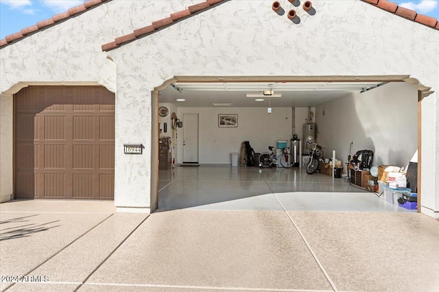 garage featuring strapped water heater