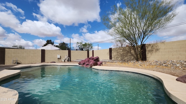 view of swimming pool with a fenced in pool and a fenced backyard