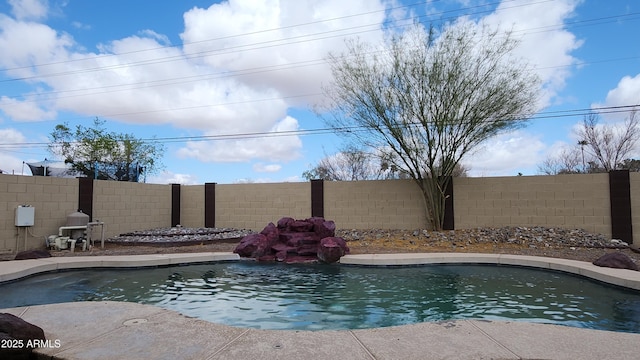 view of swimming pool featuring a fenced in pool and a fenced backyard