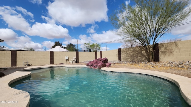 view of pool featuring a fenced in pool and a fenced backyard