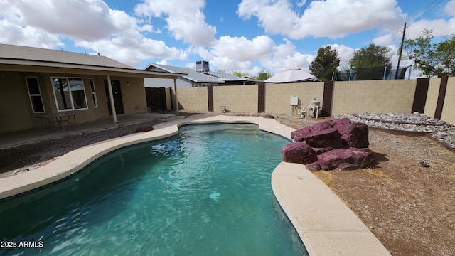 view of pool with central AC unit, a fenced in pool, a patio, and a fenced backyard