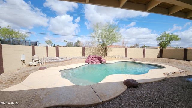 view of swimming pool with a fenced backyard and a fenced in pool