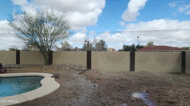 view of yard featuring a fenced backyard and a fenced in pool