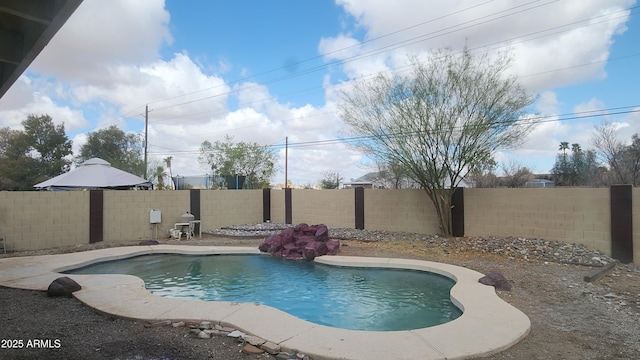 view of pool featuring a fenced backyard and a fenced in pool