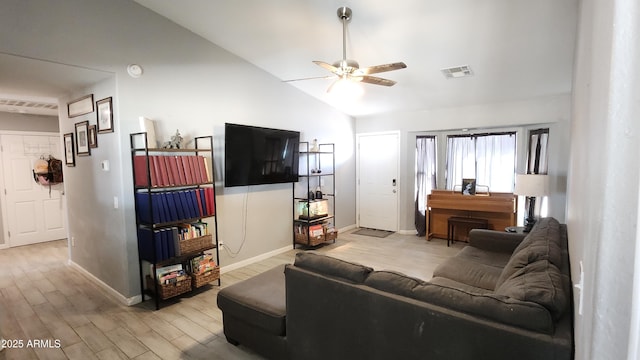 living area with baseboards, visible vents, lofted ceiling, ceiling fan, and light wood-style floors