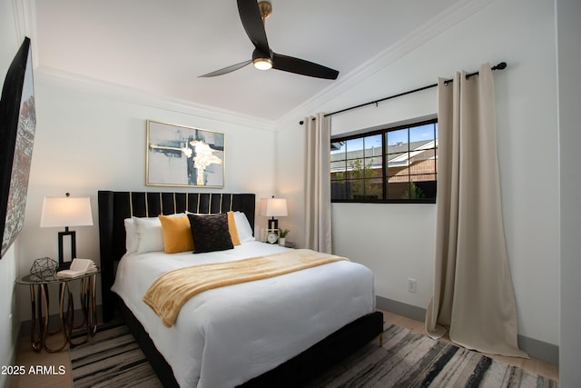 bedroom with ceiling fan, dark hardwood / wood-style flooring, crown molding, and vaulted ceiling