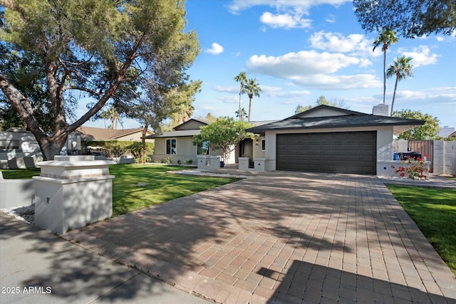 single story home with a front yard and a garage