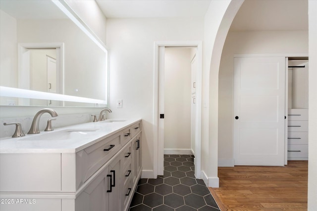 bathroom featuring vanity and wood-type flooring