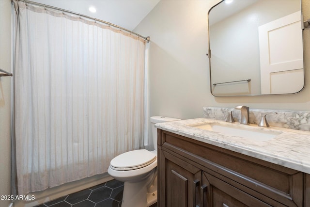 full bathroom with shower / tub combo, vanity, tile patterned floors, and toilet