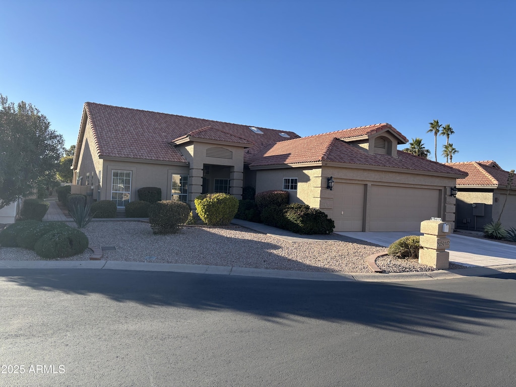 view of front of property with a garage