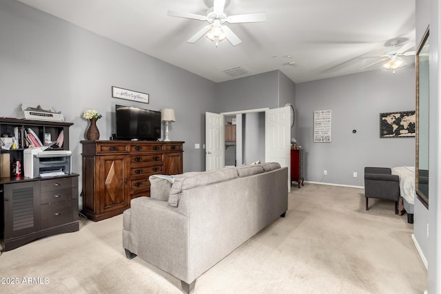 12798 W Dove Wing Way, Peoria, AZ 85383 - living room with a ceiling fan, light colored carpet, and baseboards
