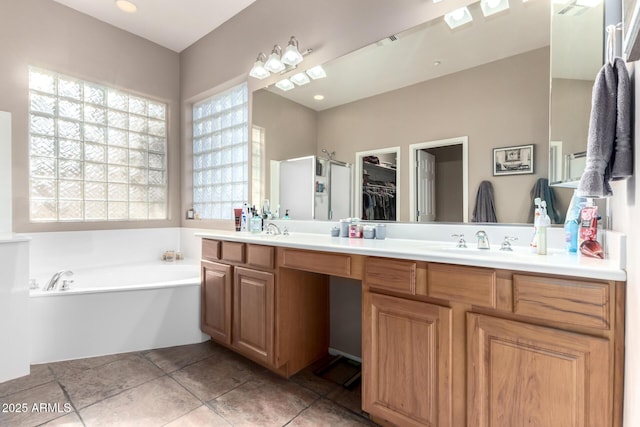 12798 W Dove Wing Way, Peoria, AZ 85383 - full bathroom with a garden tub, double vanity, tile patterned floors, and a walk in closet