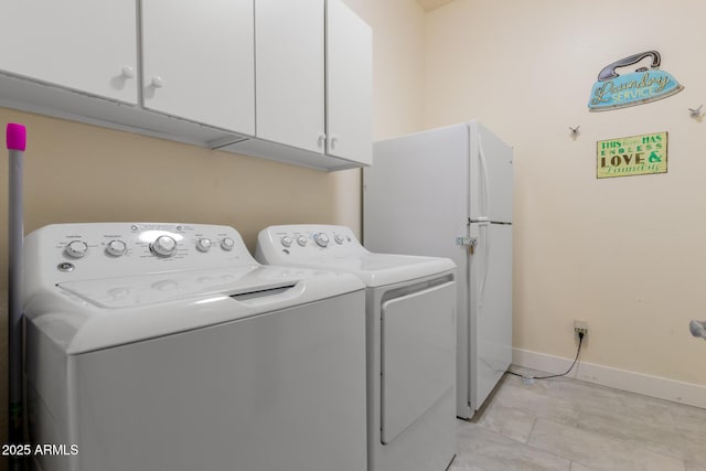 12798 W Dove Wing Way, Peoria, AZ 85383 - clothes washing area featuring washer and dryer, cabinet space, and baseboards