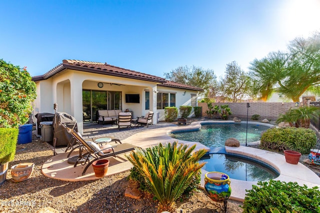 12798 W Dove Wing Way, Peoria, AZ 85383 - view of pool with outdoor lounge area, a patio area, a fenced backyard, grilling area, and a pool with connected hot tub
