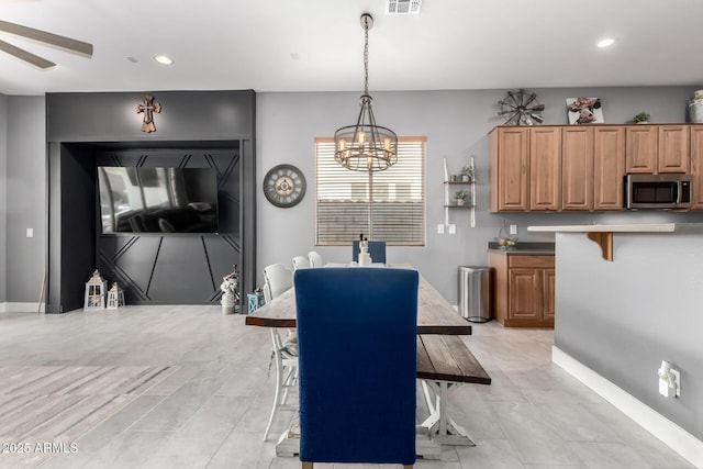 12798 W Dove Wing Way, Peoria, AZ 85383 - dining area featuring a chandelier, recessed lighting, a ceiling fan, and baseboards