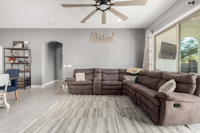 12798 W Dove Wing Way, Peoria, AZ 85383 - living area featuring arched walkways, a ceiling fan, recessed lighting, and baseboards