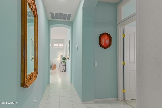 corridor with light tile patterned flooring