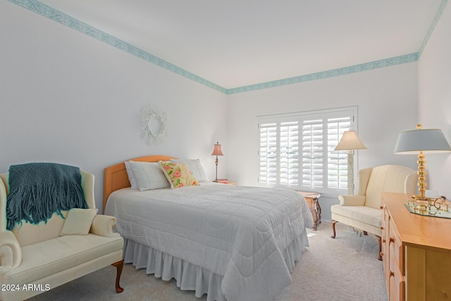 bedroom with light colored carpet