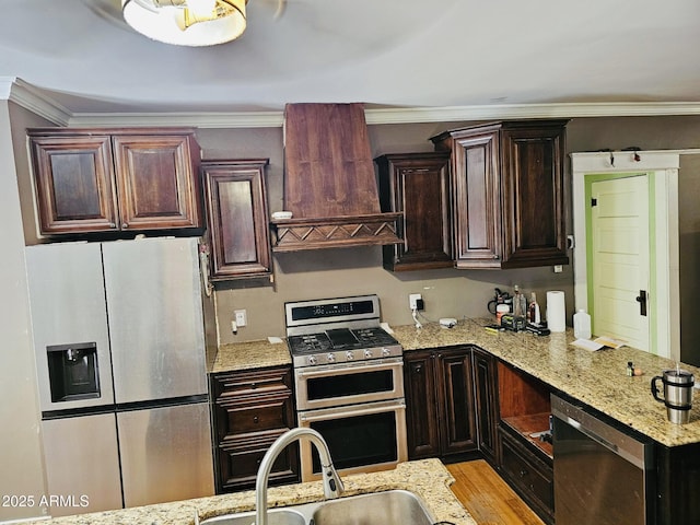 723 E Moreland St, Phoenix, AZ 85006 - kitchen with stainless steel appliances, a sink, custom range hood, light stone countertops, and crown molding