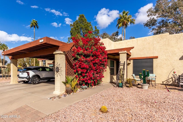 view of front of home featuring a carport