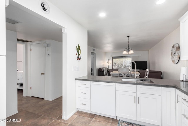 kitchen featuring white cabinets, hanging light fixtures, sink, and dishwasher