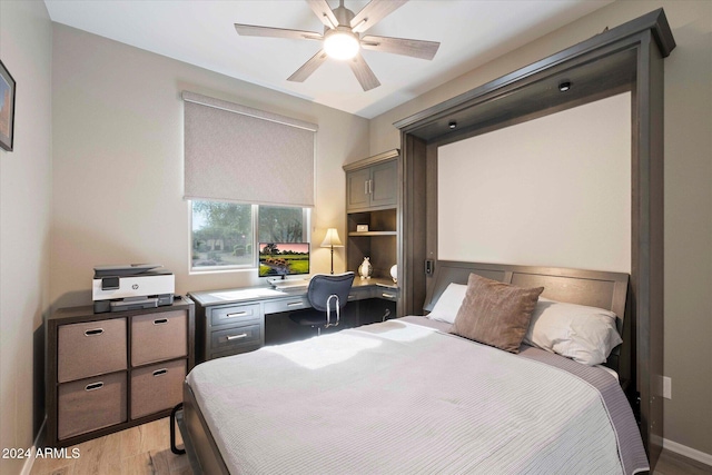 bedroom with light hardwood / wood-style flooring and ceiling fan