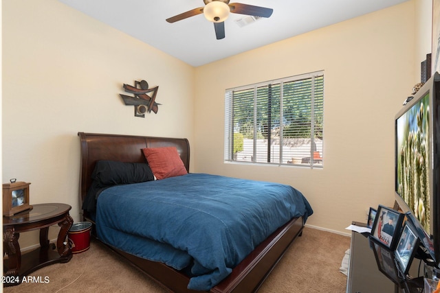 bedroom with light carpet and ceiling fan