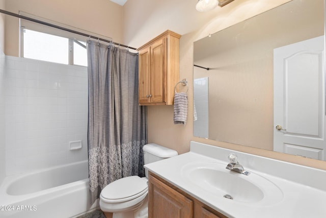 bathroom with toilet, shower / tub combo, and vanity