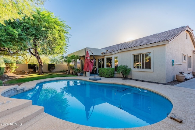 view of swimming pool with fence and a fenced in pool