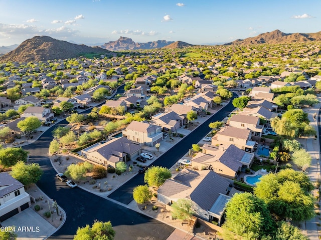 birds eye view of property with a mountain view