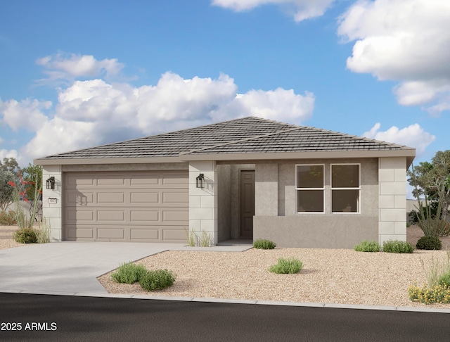 5522 W Buist Ave, Laveen, AZ 85339 - view of front of property featuring concrete driveway, an attached garage, and stucco siding