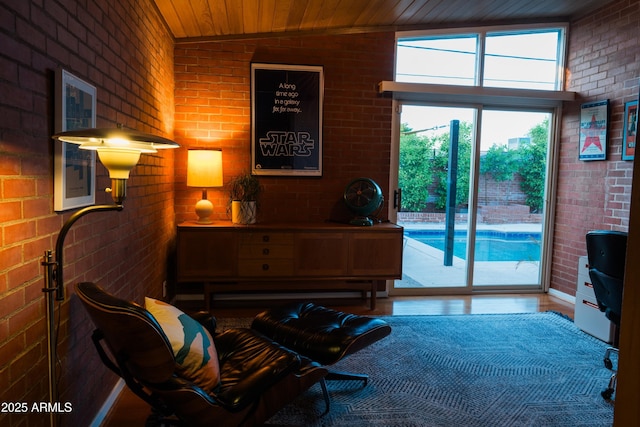 712 W Vernon Ave, Phoenix, AZ 85007 - sitting room with brick wall, wooden ceiling, and vaulted ceiling