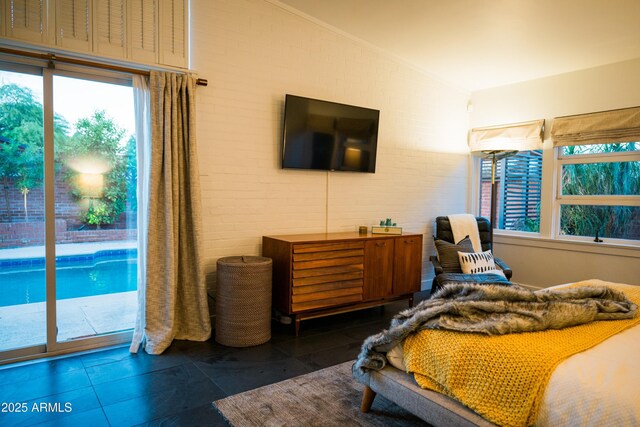 712 W Vernon Ave, Phoenix, AZ 85007 - bedroom featuring dark tile patterned floors, vaulted ceiling, and access to outside