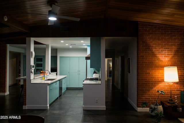 712 W Vernon Ave, Phoenix, AZ 85007 - kitchen featuring lofted ceiling, stainless steel dishwasher, brick wall, a sink, and light countertops