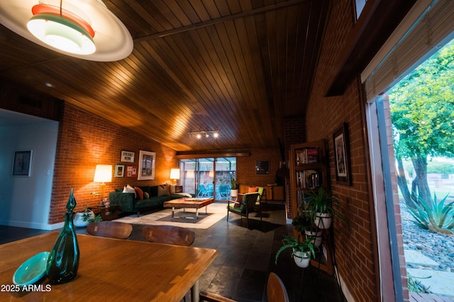 712 W Vernon Ave, Phoenix, AZ 85007 - interior space featuring brick wall, vaulted ceiling, wood ceiling, and plenty of natural light