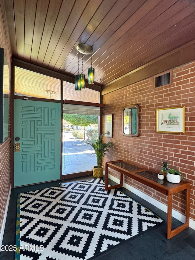 712 W Vernon Ave, Phoenix, AZ 85007 - foyer entrance with brick wall, visible vents, and wood ceiling