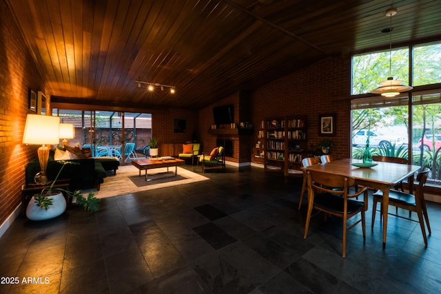 712 W Vernon Ave, Phoenix, AZ 85007 - dining room with brick wall, plenty of natural light, and vaulted ceiling