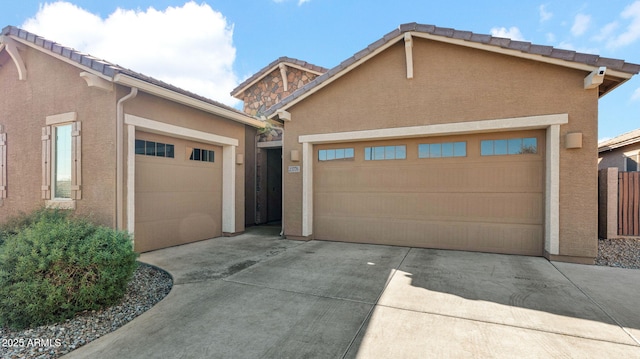 view of front of property with a garage and an outdoor structure